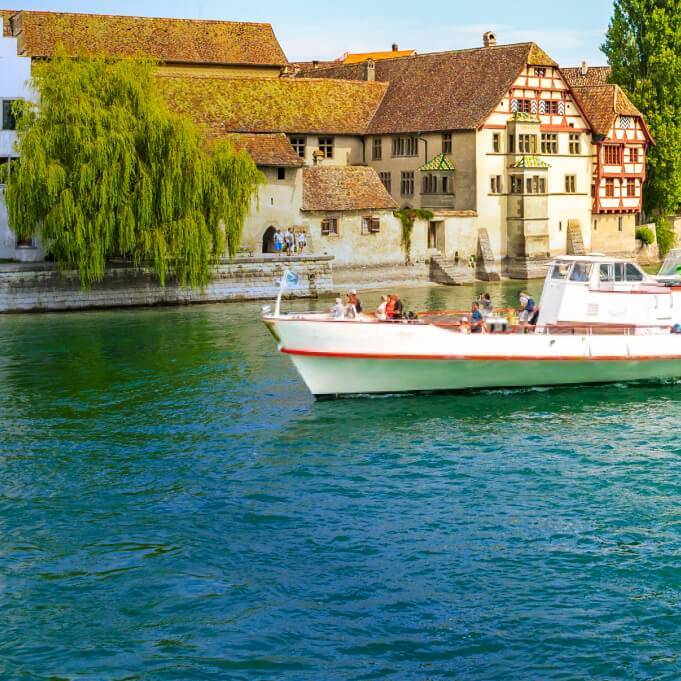 A Main River Cruise passing by St. George's Abbey in Stein am Rhein, Switzerland.